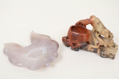two small figurines of a man and a woman on a motorbike