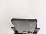 a cell phone that is sitting on top of a stand