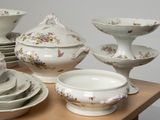 a table with a lot of dishes and bowls on it