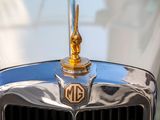 a close up of a car with a hood ornament on it