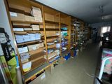 a room filled with lots of books and boxes