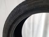a close up of a tire on a white surface