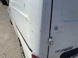 a white van that is parked in a parking lot