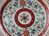 a decorative plate with a flower design on it