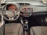 a dashboard of a small car with a steering wheel