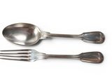 two spoons and a fork on a white surface