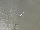 a close up of a metal pan with water in it