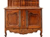 an old wooden cabinet with two doors and a drawer on top of it