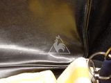 a black bag with a yellow towel and a black bag with a white bag and a black bag with a white bag and a black bag with a yellow