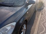 a black car that is parked on the side of the road