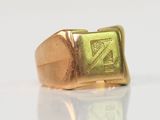 an image of a gold signet ring with a z symbol on it
