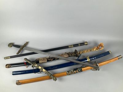 four different types of samurai swords on a white surface