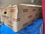 a large cardboard box sitting on top of a blue tarp
