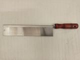 a knife that is laying on a table