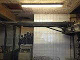 a dirty kitchen with a lot of dishes on the counter