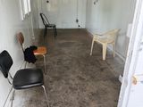 a room with two chairs and a table in it