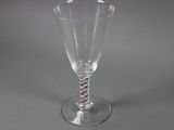 a wine glass with a red, white, and blue stripe on it