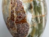 a close up of a green and brown stone