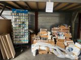 a lot of boxes and a carton of items in a garage