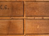 an old wooden box with a number on it