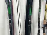 many different types of fishing rods and poles on the wall