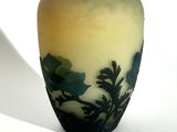 a vase that has a picture of a tree on it