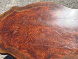 a wooden table that is sitting on the ground