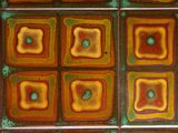 a picture of a tiled floor with different colored tiles