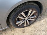 a close up of a car ' s tire on the ground