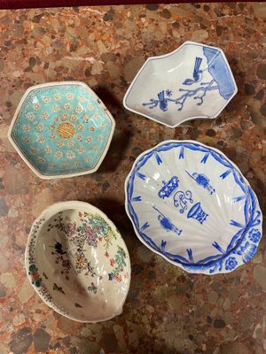 three bowls are sitting on a table next to each other