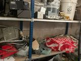 a lot of items on the shelves in the room