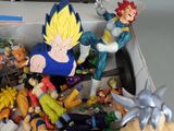 a bunch of action figures in a box