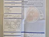 une photo d'un ticket de caisse sur laquelle figure la photo d'une voiture