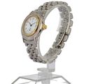 a silver and gold wrist watch on a clear stand