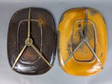 two brown and yellow plates with a clock on them