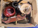 a cardboard box full of assorted items on the floor