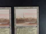 two cards on a table with a picture of a building