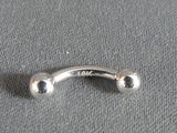 a silver ring with two balls on top of it