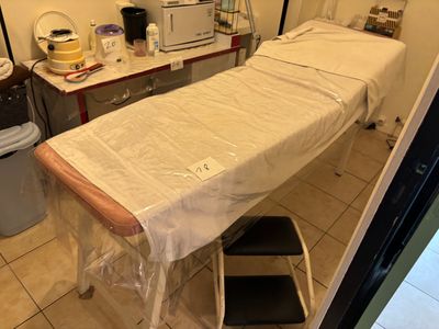 a table with a sheet on it in a room