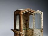 a small wooden cabinet with a mirror in it