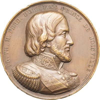 an image of a gold medal with a portrait of a man on it