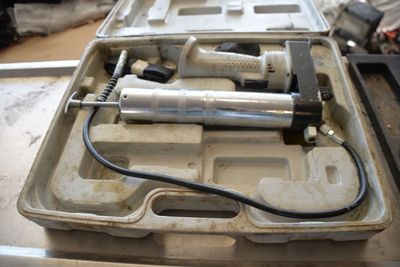 a box with tools in it sitting on a table