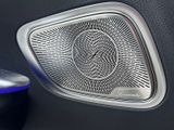 a close up of a car door with a speaker in it