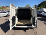 a white van with its doors open in a parking lot