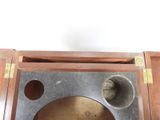 a clock that is sitting on top of a wooden table