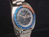 a silver watch with a blue face and a red second hand