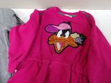 pink dress with a duck appliqued on the front of it