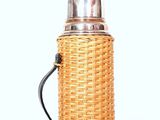 a bottle with a handle on a white surface