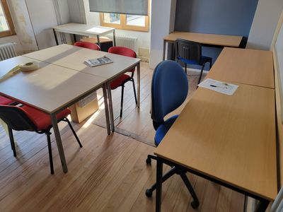 a room with a table and chairs in it