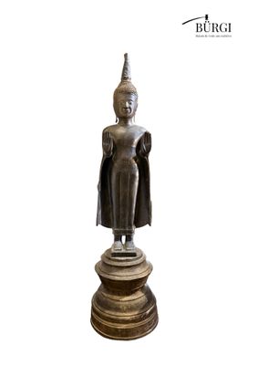 an image of a statue of a person standing on a pedestal